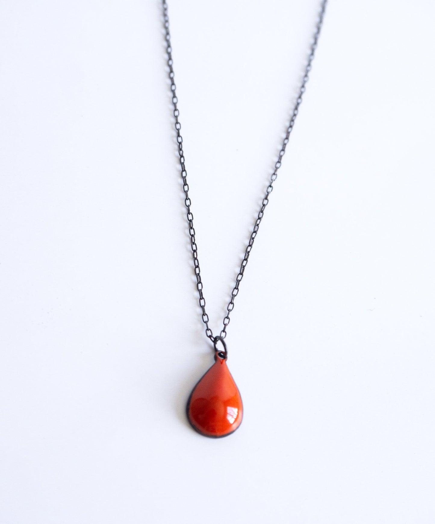 black sterling silver chain with red drop