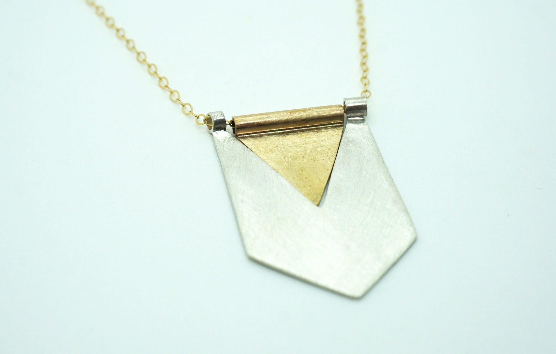 Silver and brass flag pendant necklace