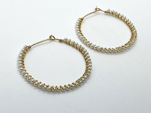 Pearl wrapped gold hoop earrings