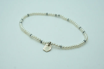 white pearl stretch bracelet with sterling silver accents
